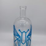 Logo embossed bottle with silk screen printing
