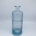 Blue painted bottle with embossed ribbons